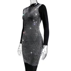 Close-up detail of sexy sparkling rhinestone fishnet mesh dress for nightclub party