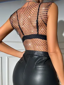 Close-up detail of sexy fishnet mesh top with sparkling blue rhinestones on the back