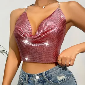 Close-up of pink metallic sequin halter top with deep V-neck and sparkling finish