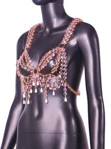 Detail view of pink crystal gem body chain top with elegant white pearl drop accents