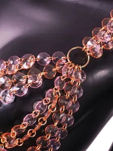 Close-up detail of pink hexagonal gemstone link chain for sexy nightclub camisole tube top