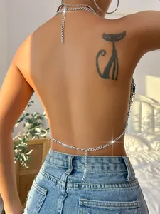 Back view of a sexy silver chain halter top with a minimalist open-back design.