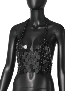 Detailed macro view of a sexy black acrylic sequin disc halter neck crop top vest.