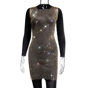 Macro view showing the intricate gold mesh pattern and shimmering rhinestones of the party dress.