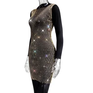 Elegant black long sleeve mini dress with golden rhinestone mesh overlay detail