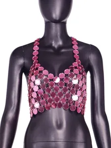 Close-up view of a shimmering pink acrylic sequin halter neck backless crop top.