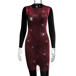 Close-up of red fishnet mesh dress with sparkling rhinestones over black sleeves
