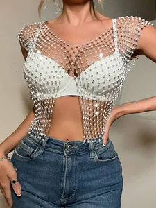 Detailed close-up of white rhinestone fishnet crop top with sexy sparkle mesh design