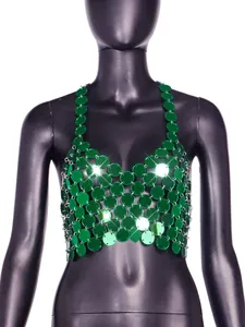 Close-up of green acrylic sequin halter top with metallic ring connectors for nightclub