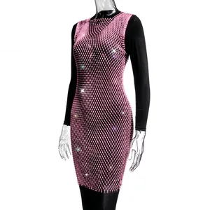 Close-up detail of pink rhinestone mesh dress showing the sparkling crystal craftsmanship
