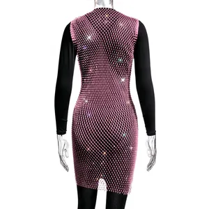 Detail of pink mesh dress featuring shimmering rhinestones over a black bodysuit base.