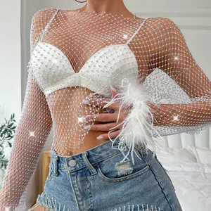 Detailed view of white rhinestone fishnet top featuring elegant feather trim cuffs