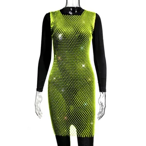 Close-up of lime green mesh dress with sparkling rhinestone details for a glamorous look