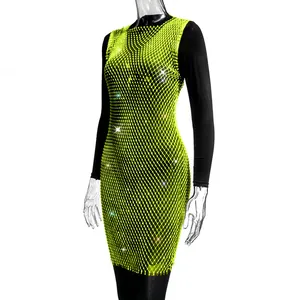 Detail view of lime green rhinestone mesh dress featuring sparkling crystal embellishments.