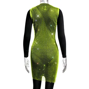 Close-up detail of a sexy neon green rhinestone mesh fishnet dress for party wear