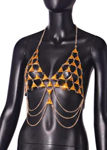 Close-up detail of a sexy orange triangle gemstone body chain vest for beach party.