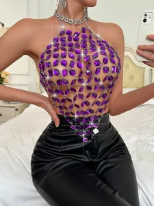 Macro view of purple acrylic gem halter top with sparkling metal chain details