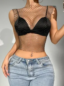 Close-up of black mesh tank top with sparkling rhinestones and fishnet detail