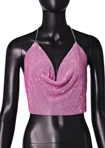 Stunning close-up detail of a pink rhinestone halter crop top with shiny chain straps