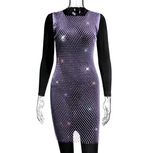 Detailed view of elegant purple mesh dress featuring sparkling rhinestone embellishments
