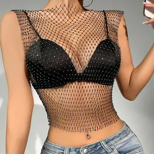 Close-up of sexy rhinestone mesh crop top with hollow-out fishnet detail for clubwear.