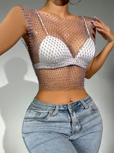 Close-up detail of purple rhinestone fishnet mesh top featuring shimmering crystal embellishments