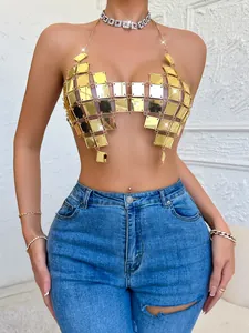 Close-up detail of a sexy gold acrylic patchwork halter top showing texture and fit.