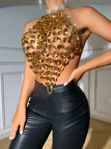 Detailed view of glamorous yellow acrylic gem and metal chain halter backless crop top