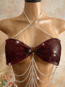 Macro detail of wine red rhinestone mesh body chain featuring elegant silver tiered tassels