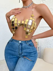 Close-up detail of a gold acrylic patchwork sexy backless top with geometric mesh design