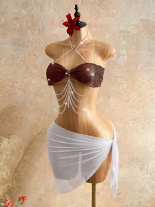Exquisite burgundy rhinestone mesh body chain with layered silver tassel design on mannequin