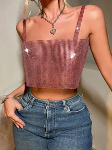 Close-up detail of sexy pink rhinestone fishnet camisole crop top with sparkling crystals