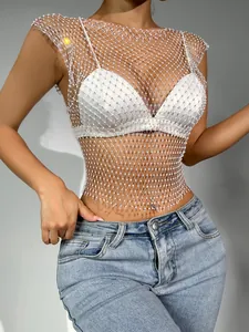 Close-up detail of sexy mesh rhinestone top with hollow out fishnet design for clubwear