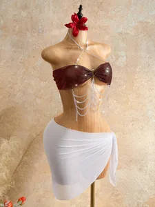 Detail view of burgundy rhinestone mesh bra body chain with silver tassel fringe