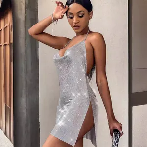 Sparkling silver metallic sequin halter mini dress with high side slit and backless design