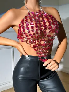 Close-up detail of sexy pink acrylic gem halter top with metallic chains and backless design