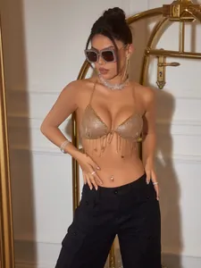 Glamorous gold metallic mesh tassel halter top with deep V-neck for clubwear and festivals