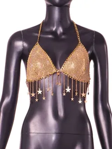 Detail of gold rhinestone bra top with hanging star chain fringe for nightclub parties