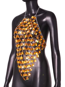 Detailed view of amber acrylic gemstones on a silver metal chain halter body top