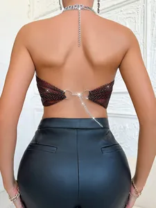 Detailed back view of a wine red rhinestone mesh body chain with shiny silver fringe tassels