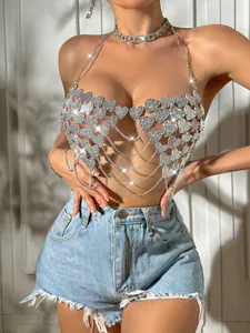 Sexy silver heart sequin halter top with metal chains detail on model for nightclub wear