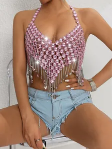 Close-up of a sexy pink gemstone-studded halter top with metallic chain fringes.