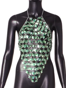 Close-up of green acrylic gemstones and silver chain on a sexy backless body vest