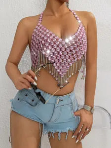 Detail view of a sexy pink rhinestone halter top with dangling silver stars and chains.
