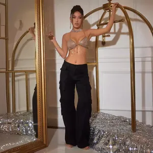 Gold fringe mesh halter top with black cargo pants for nightclub fashion outfit