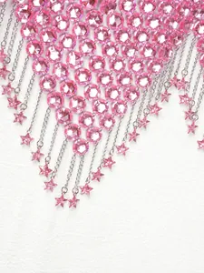 Macro view of a pink acrylic crystal body chain featuring dangling star pendants.