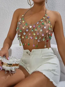 Close-up detail of sexy metallic mesh halter top with colorful gemstone leaf fringe