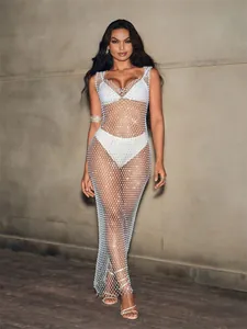 Detailed look at sparkly white fishnet beach cover-up dress over a white bikini set