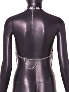 Detailed back view of a silver body chain featuring faux gemstones on a mannequin