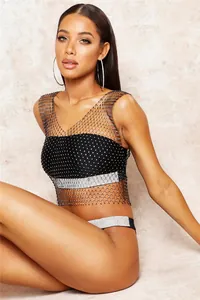 Close-up of sexy black fishnet crop top with sparkly rhinestone details for women